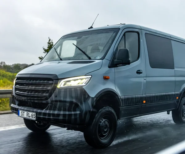 gray-cargo-van-driving-rainy-highway-delivery-rain
