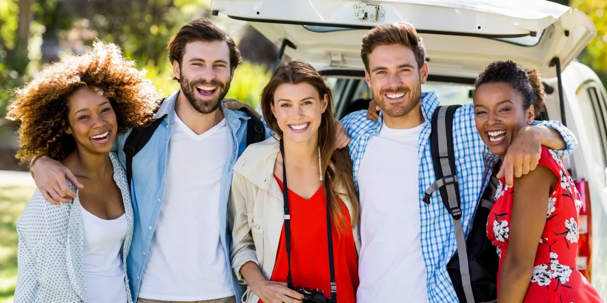 portrait-of-happy-friends-standing-with-arm-around-2026-01-11-10-31-30-utc