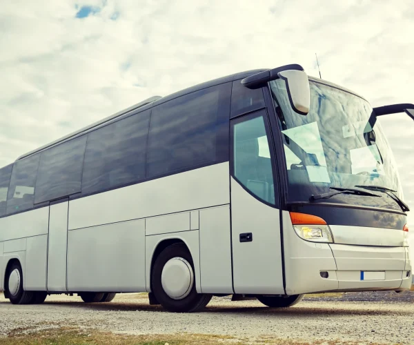 tour-bus-driving-outdoors-2026-03-09-08-12-16-utc